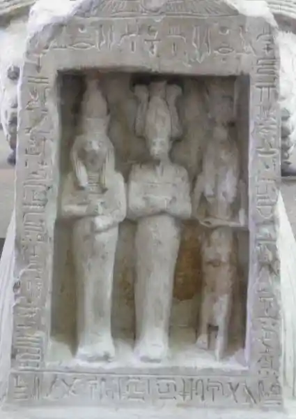 Shrine containing Horus, Osiris and Isis held by kneeling statue of Panehsy